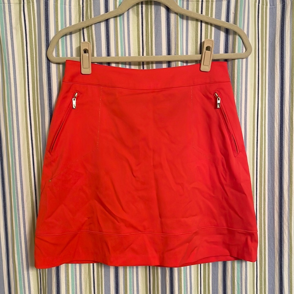 Bright orange golf skort